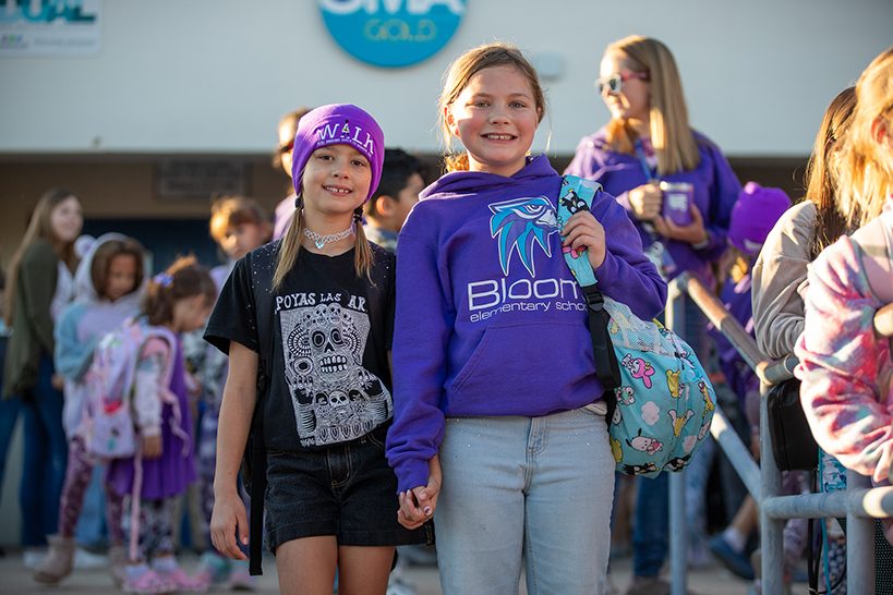 Two girls smile before the Ruby Bridges walk